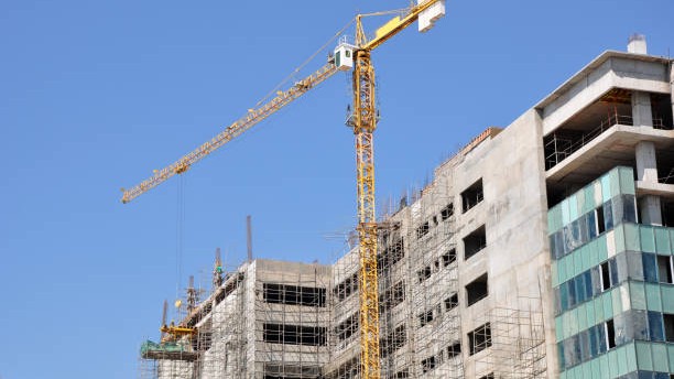 Commercial building construction site in India with cranes